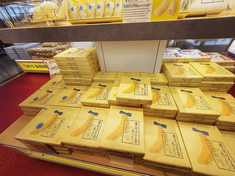 Boxes of classic sponge cake filled with rich banana custard cream, stacked one above the other, as popular souvenirs for tourists in Japan